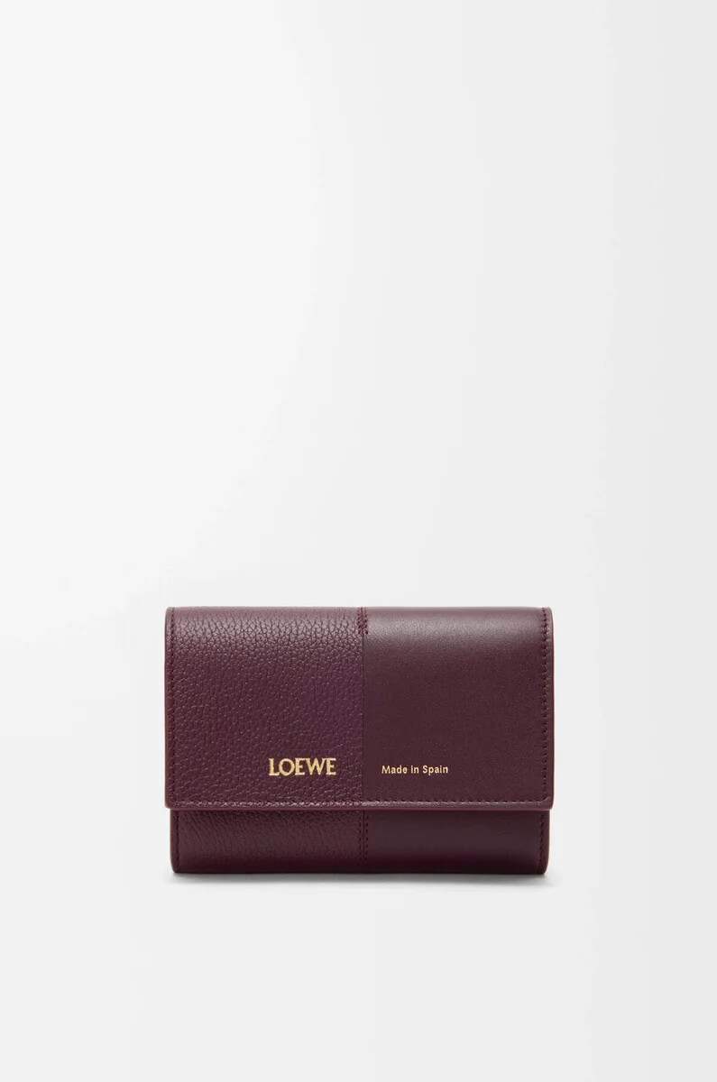 petit portefeuille vertical en cuir de veau lisse et grainé couleur bordeaux foncé