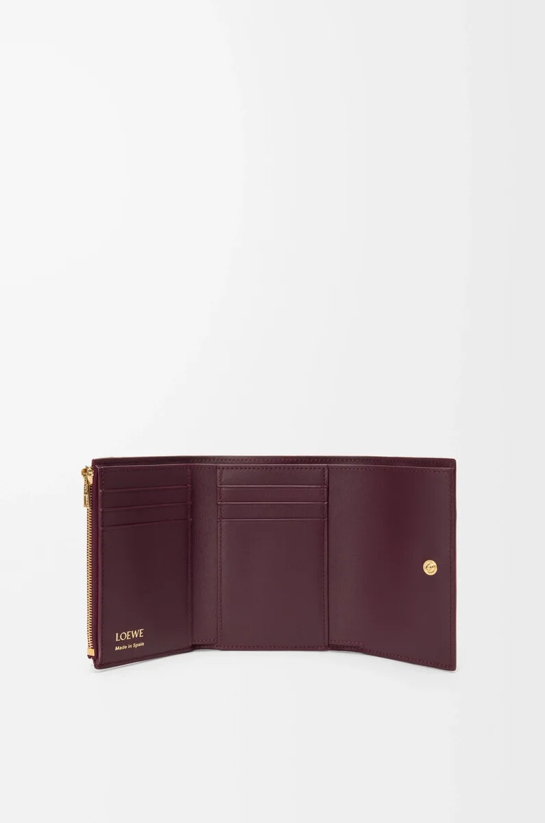 petit portefeuille vertical en cuir de veau lisse et grainé couleur bordeaux foncé